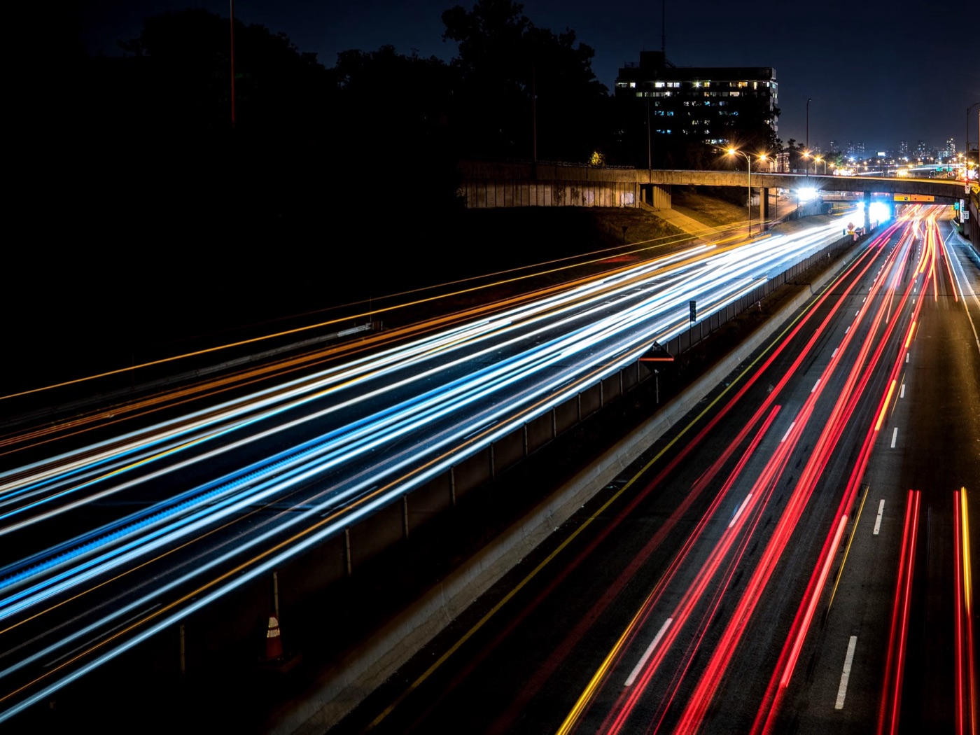Highway light trails at night — the lanes SupplyNow runs